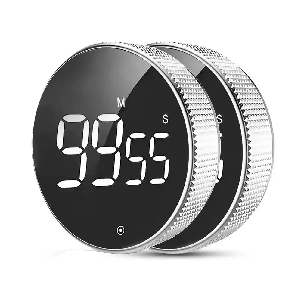 Digital timer with black display and silver casing on a white background