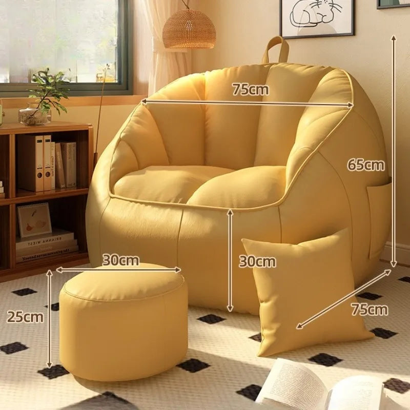 Yellow armchair with ottoman and pillow, shown with dimensions, in a room setting.