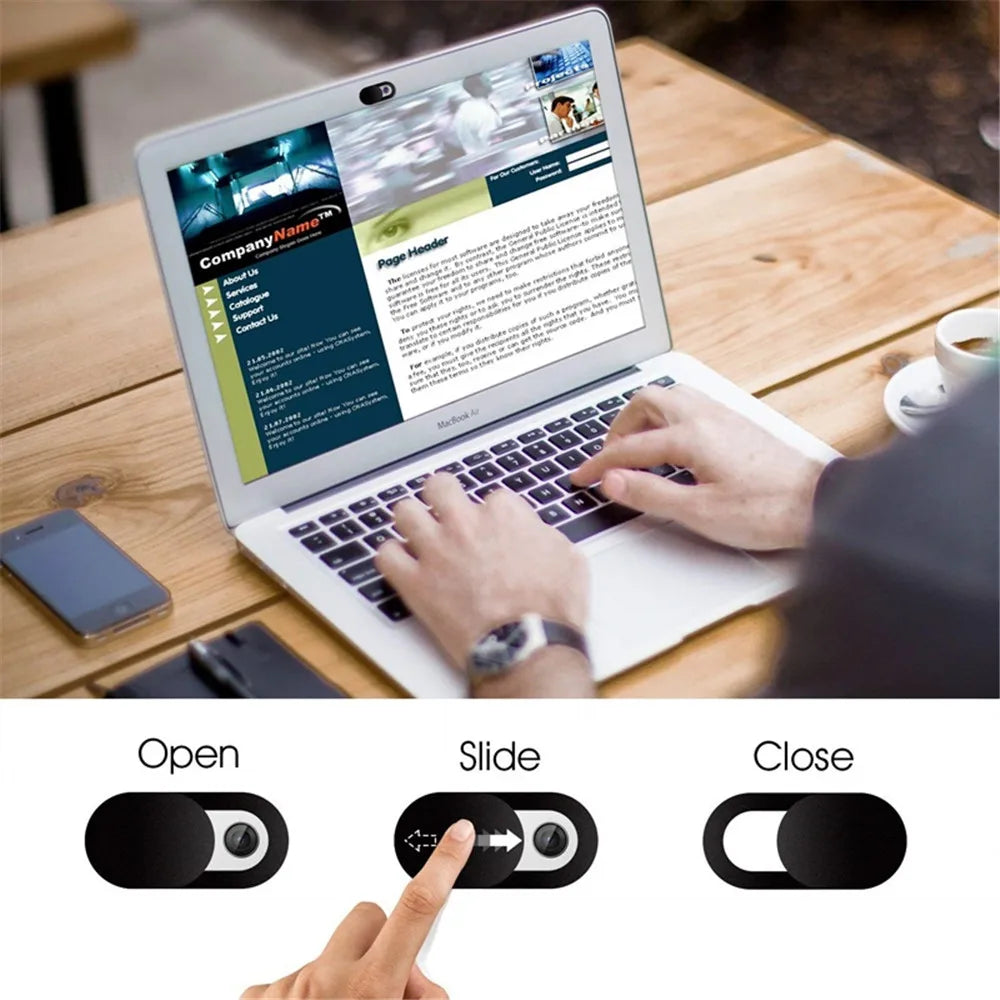 Person using a laptop with on-screen controls labeled 'Open', 'Slide', and 'Close'.