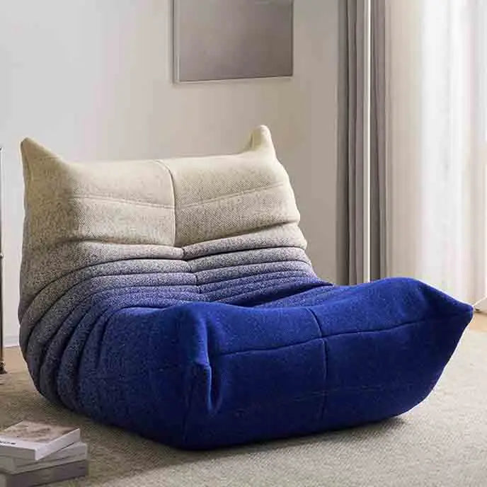 Gradient bean bag chair in a room with a neutral color scheme