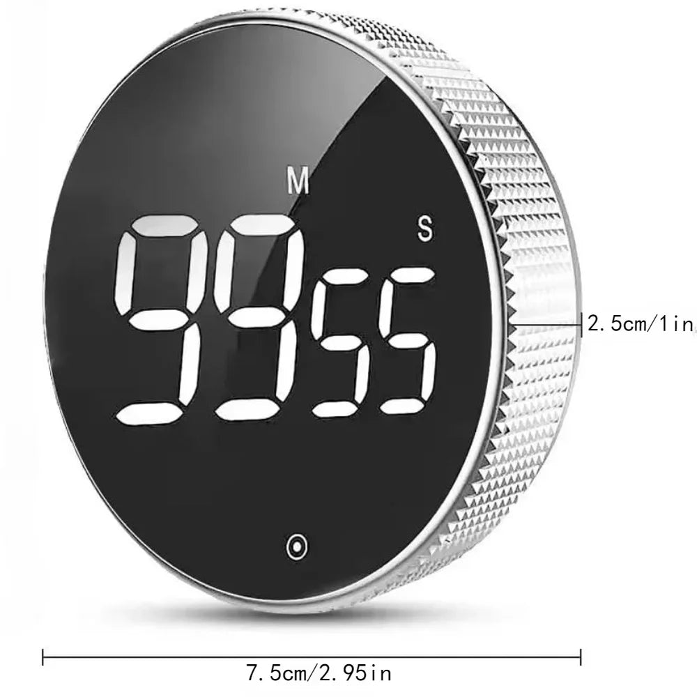 Digital timer with a black face and silver casing, showing the time '9055'.
