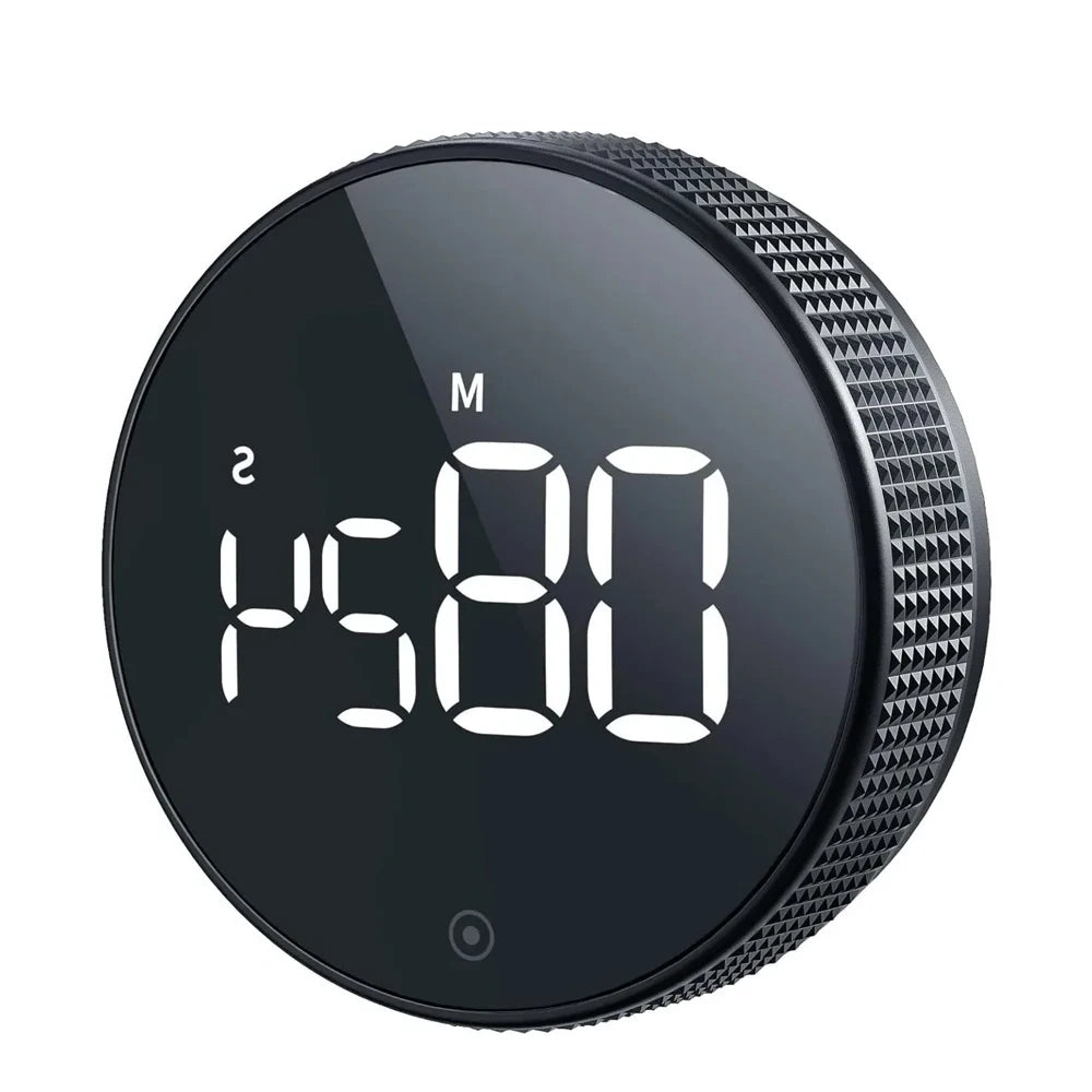 Black digital knob with LED display on a white background