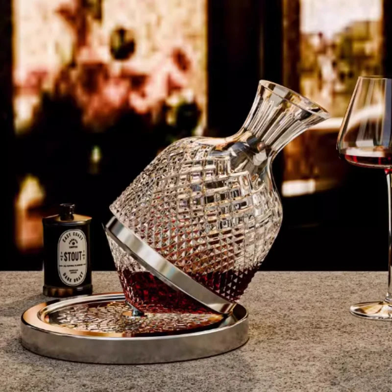 Crystal fish-shaped decanter with a bottle and glass on a table