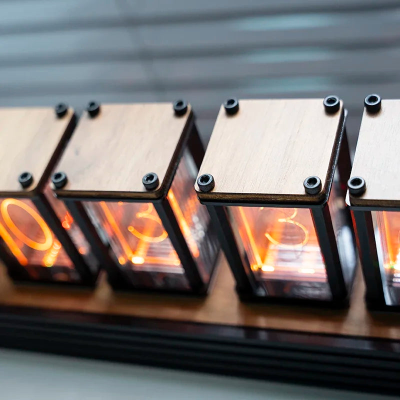 Row of illuminated electronic components on a wooden board with a blurred background