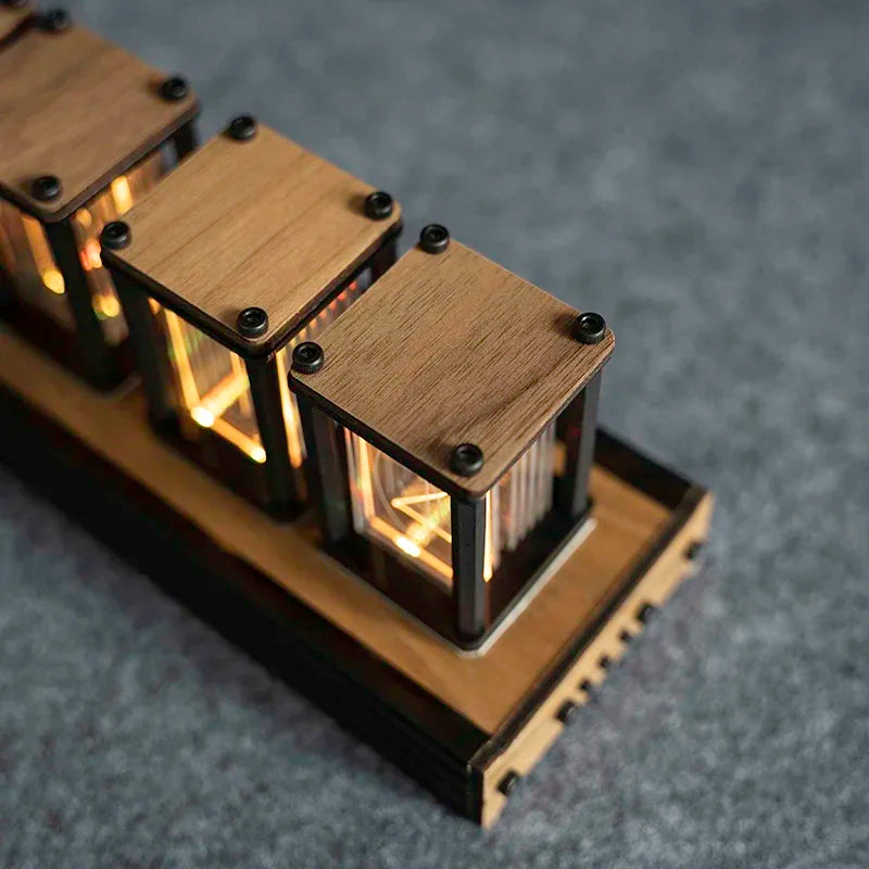 Wooden electronic device with glowing interior on a dark background