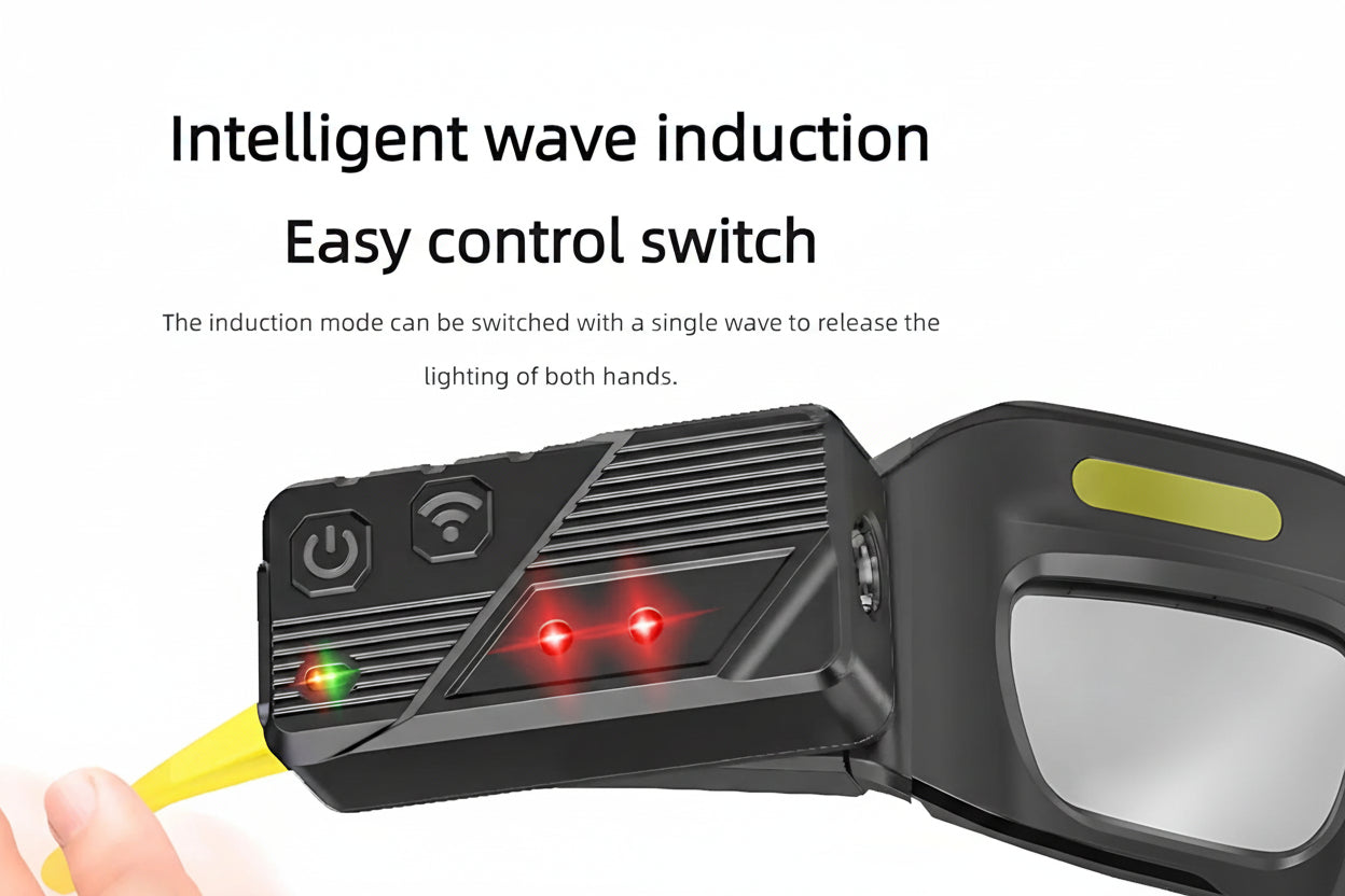 Black induction device with control switch and glowing lights, held by a hand.