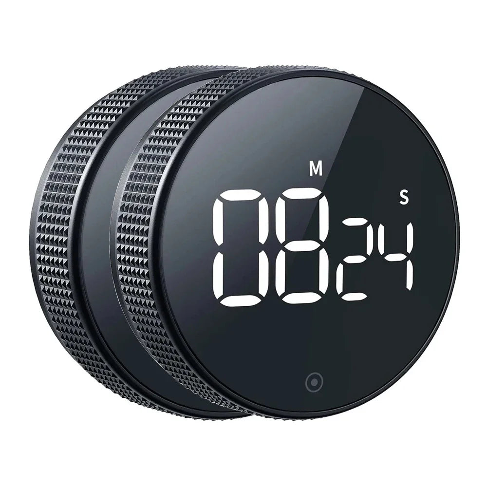 Black digital timer with digital display on a white background