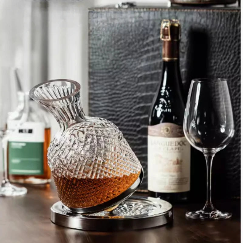 Wine decanter with wine bottle and glass on a wooden surface