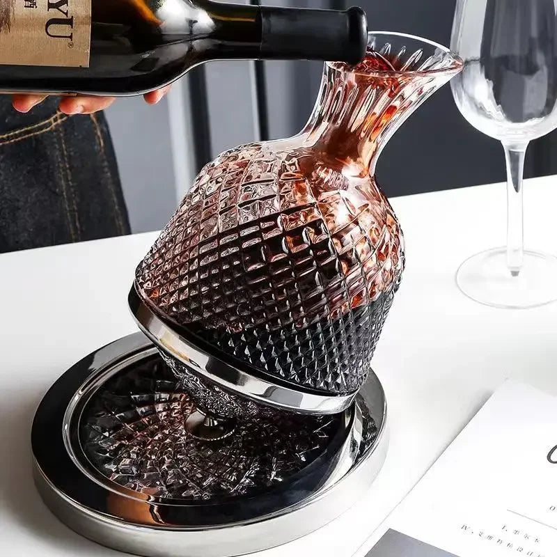 Rose gold decanter being filled with wine on a white surface