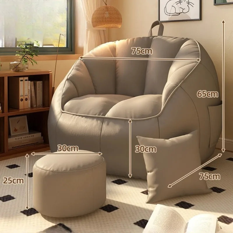 Beige armchair with ottoman and pillow, featuring dimensions, in a living room setting.