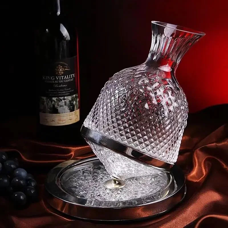 Crystal decanter with a bottle of King Vitality wine and grapes on a dark background