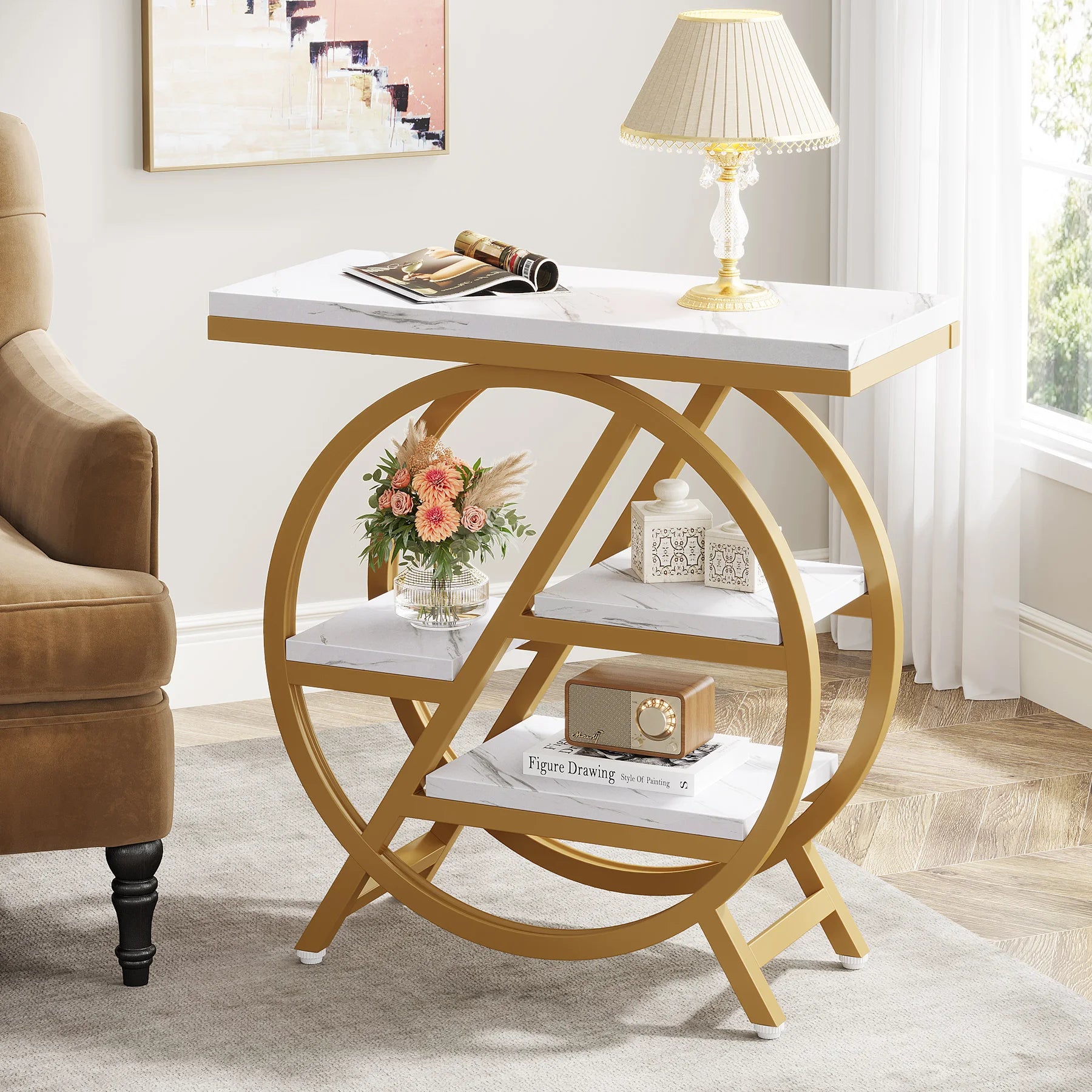Decorative side table with marble top and gold circular base in a room setting.